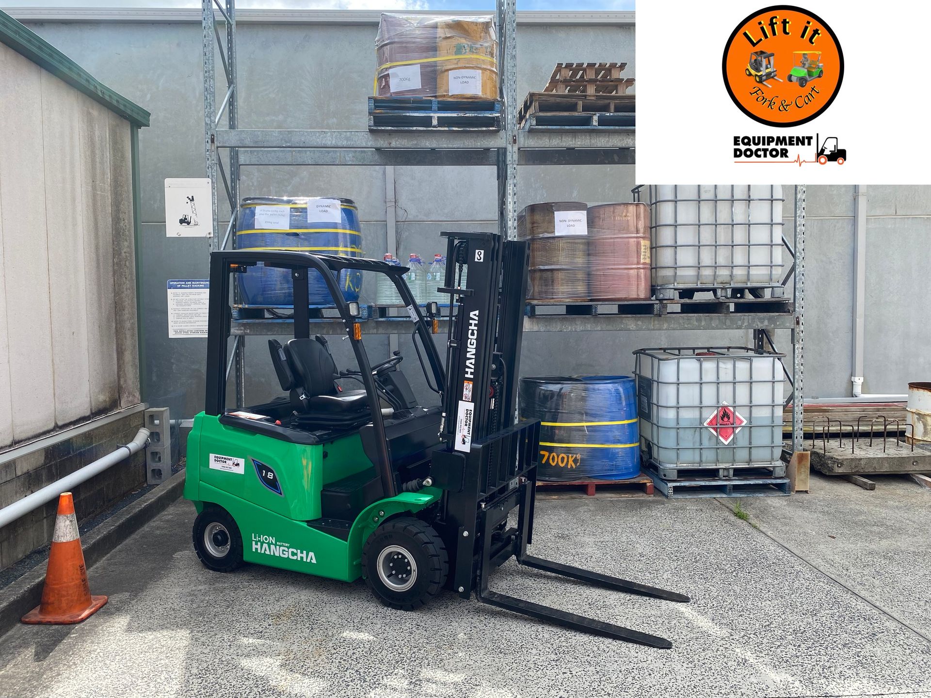 Green Forklift With Raised Forks Parked in an Industrial Yard — Lift It Equipment in Tuggerah, NSW