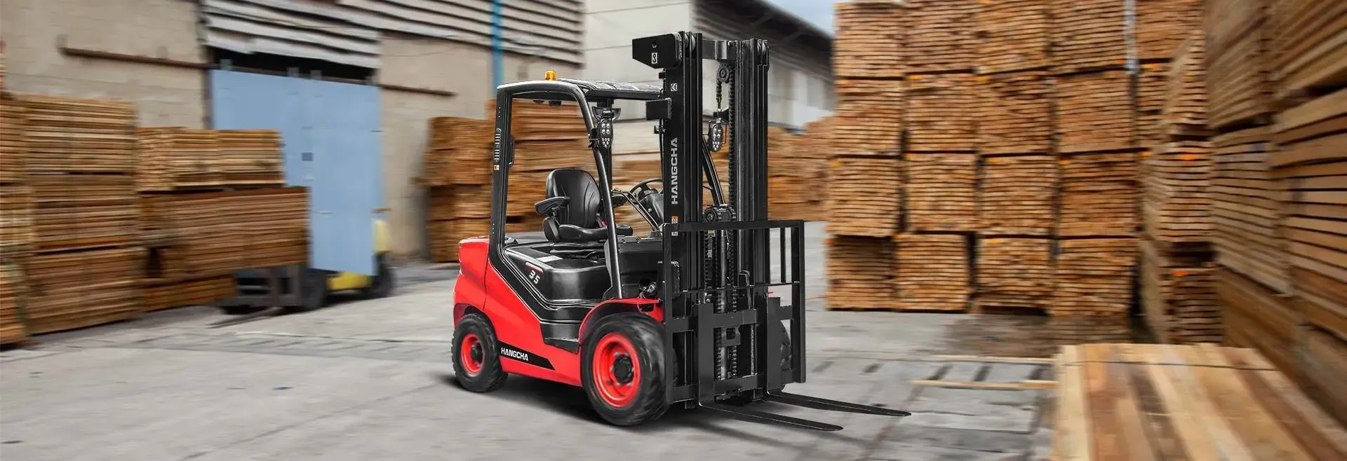 Red Forklift in a Lumber Yard, With Stacked Wood Pallets and Logs — Lift It Equipment in Tuggerah, NSW