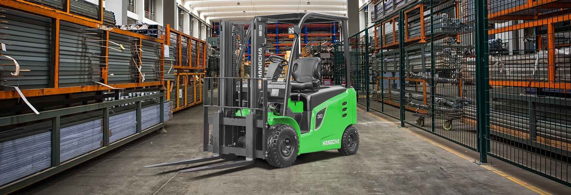 Green Forklift in A Warehouse Aisle — Lift It Equipment in Tuggerah, NSW