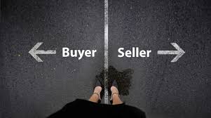 A person is standing in front of a sign that says buyer and seller.