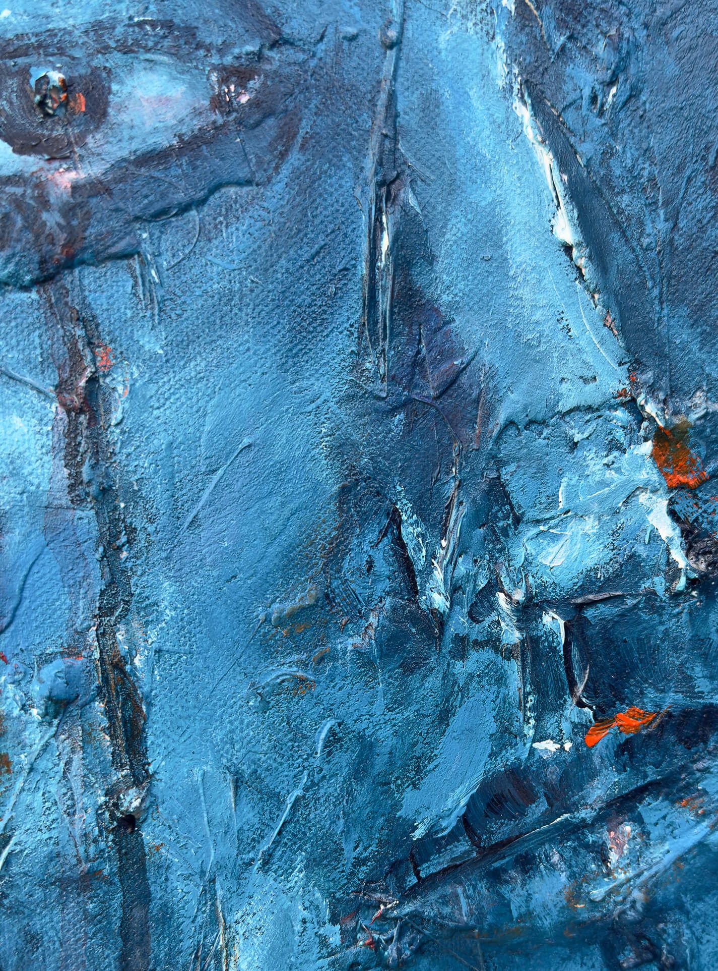 Close-up of the central face emerging from layered blue paint in A Part of Ourselves