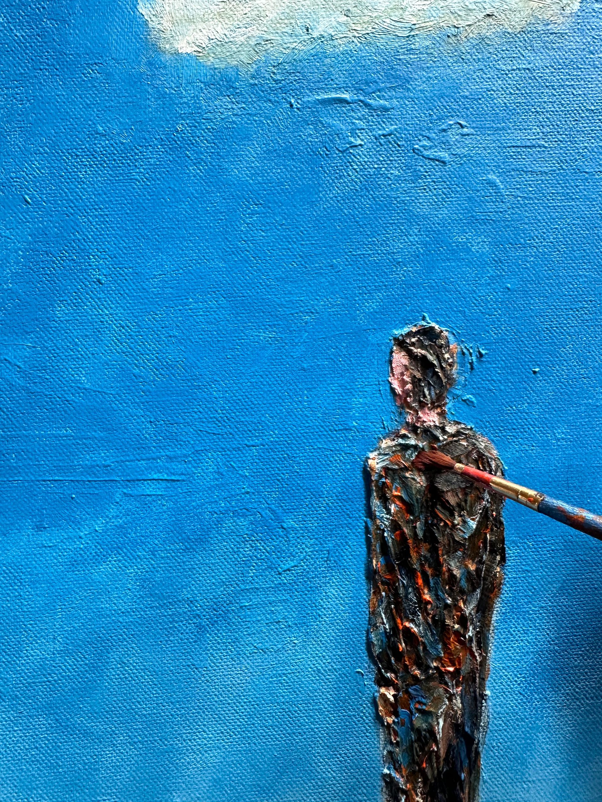 a close up view of the artists brush on the canvas. Featuring  a single figure against a blue sky