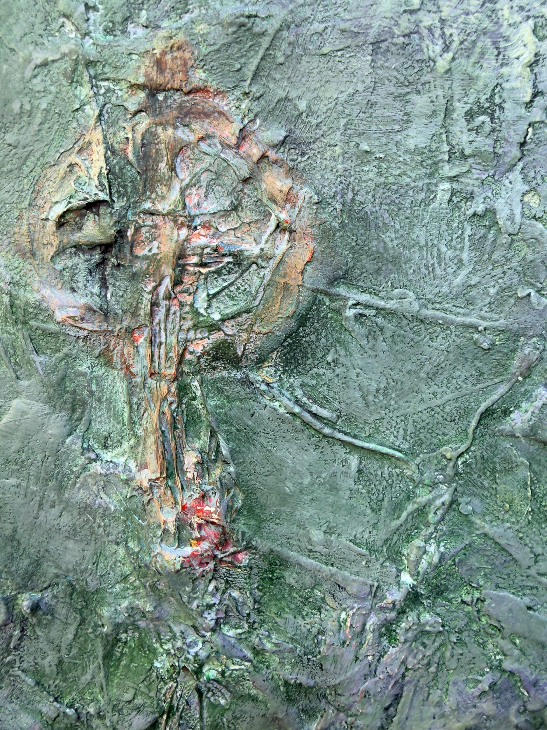 Partial profile and cruciform form emerging from the textured surface of Relic of the Divided Self