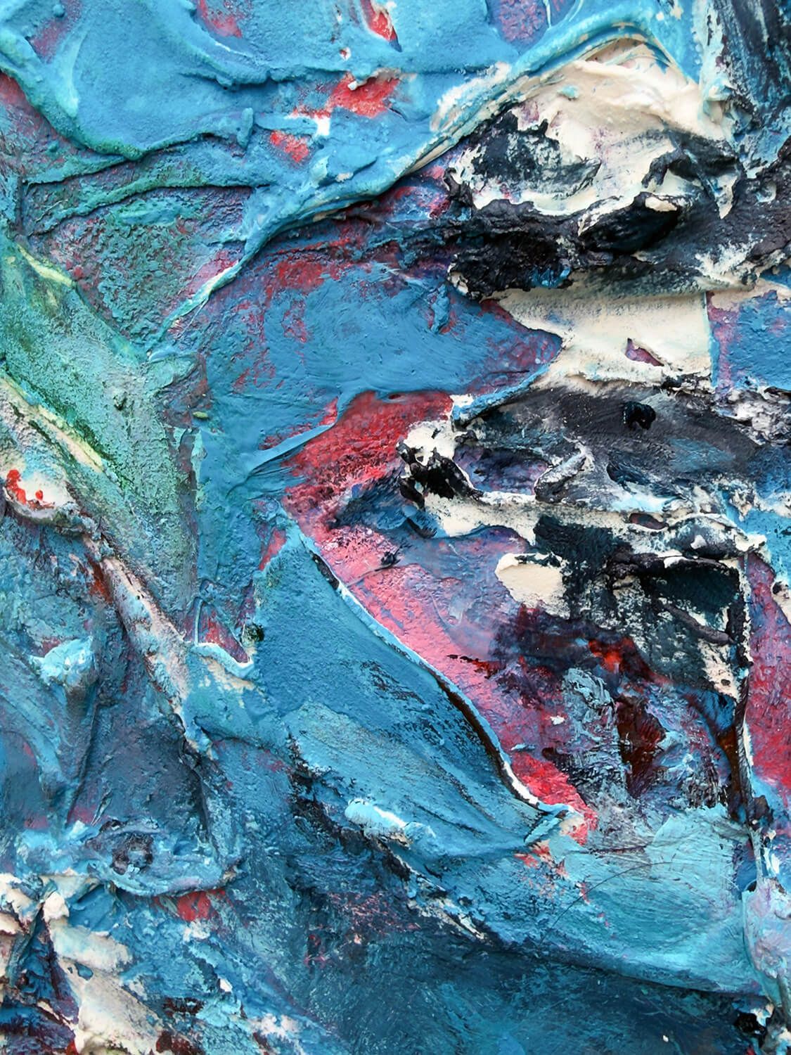 Close-up of blue, red and white acrylic, plaster and silicone within the fractured central figure