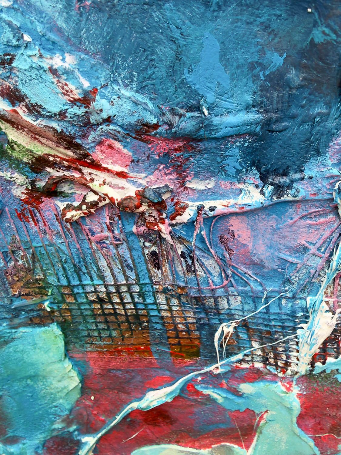 Close-up of blue, red and white acrylic, silicone and mesh within the fractured central figure