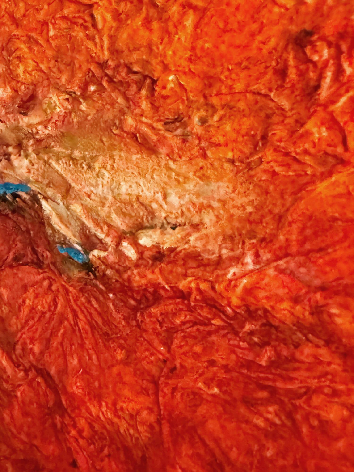 Detail of the rough orange, red and pale textured surface of The Last Drop