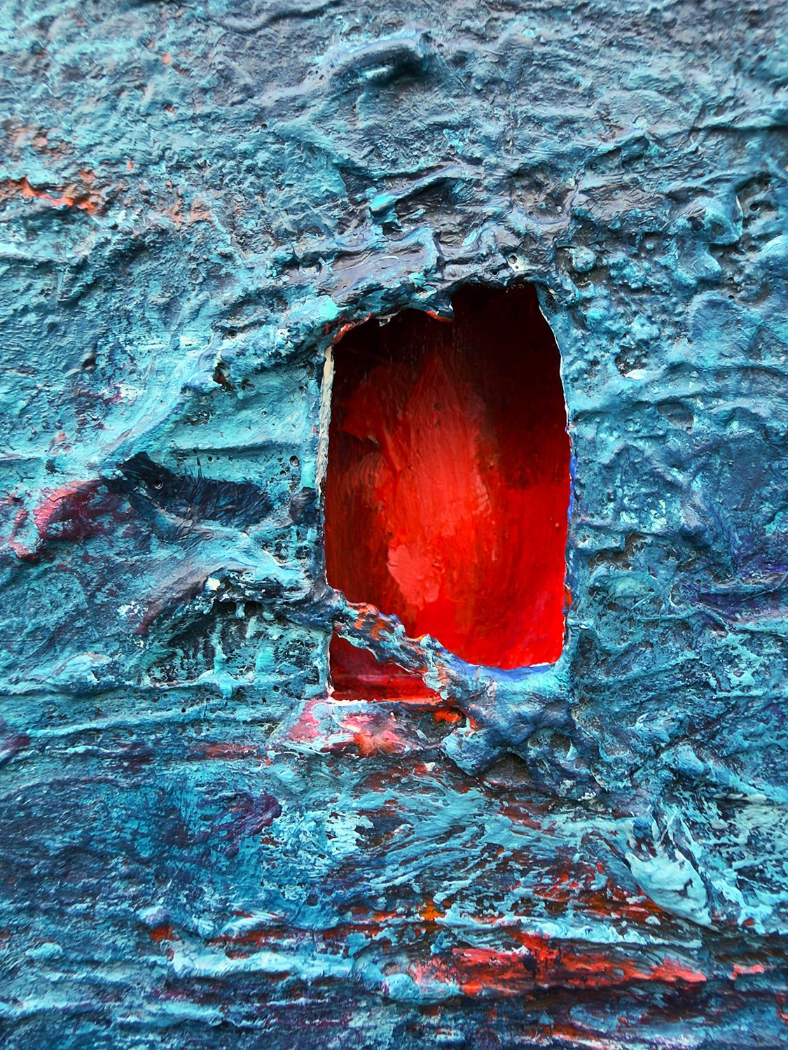Close-up of the red recessed opening and heavily layered blue surface in The Lie Was the Door.