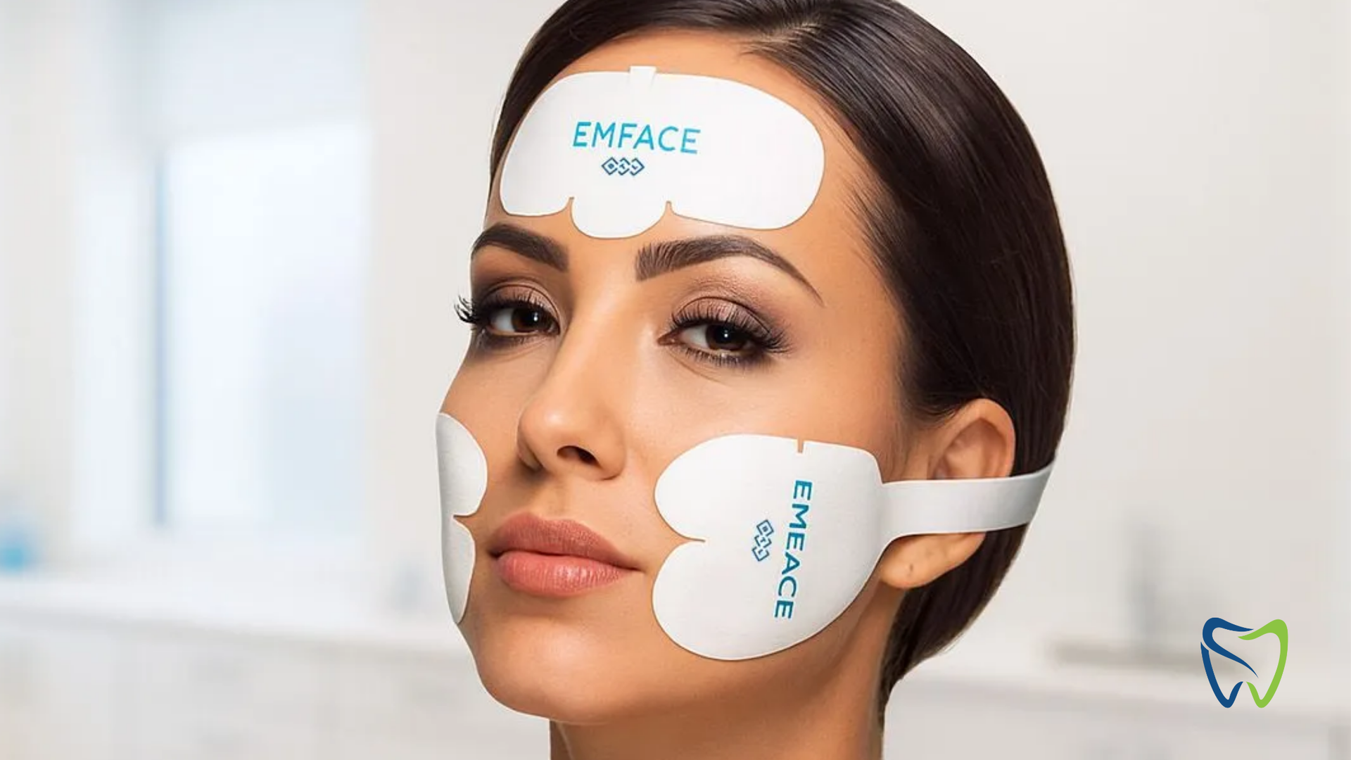 Woman wearing white facial treatment pads labeled