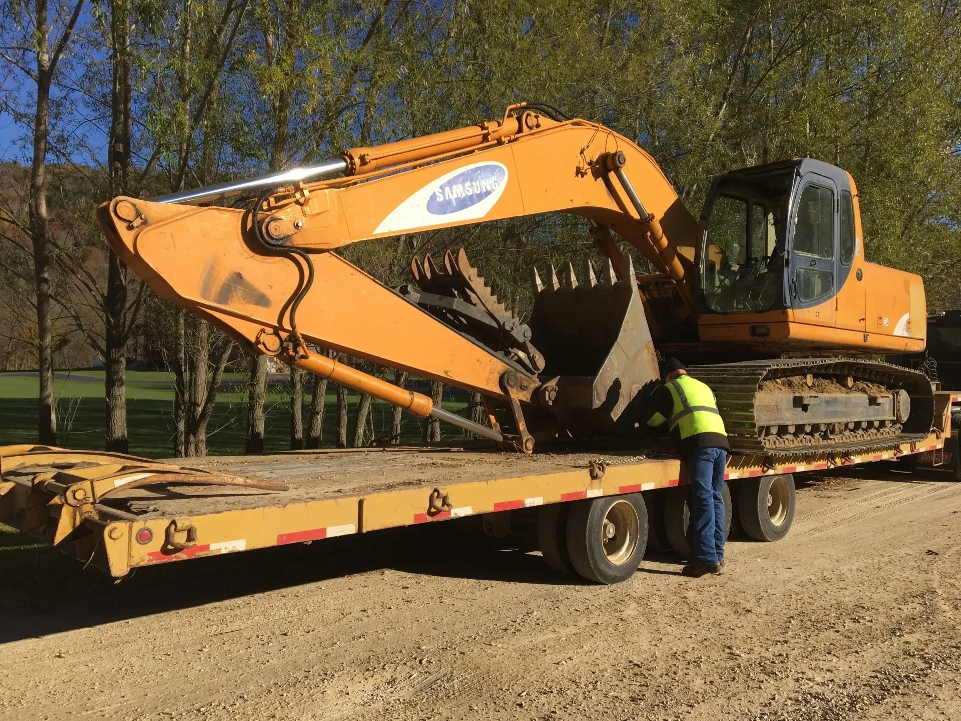 Backhoe On Trailer | Viroqua, WI | Bruce Hill, LLC