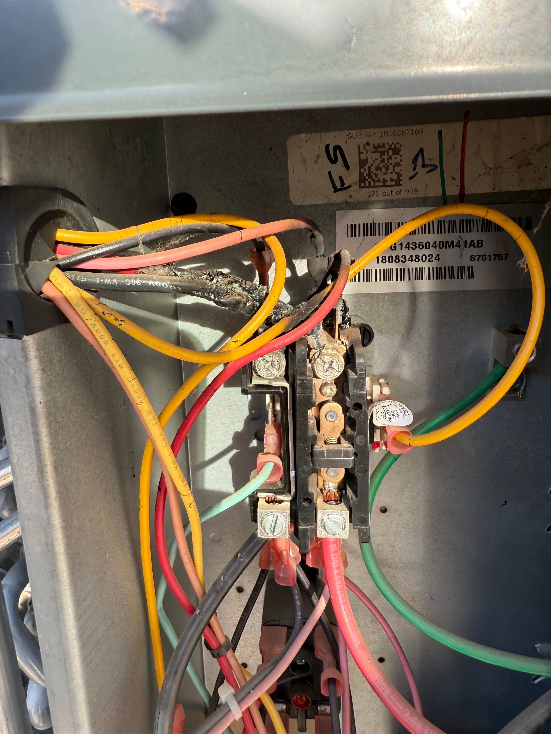 A bunch of wires are connected to a metal box