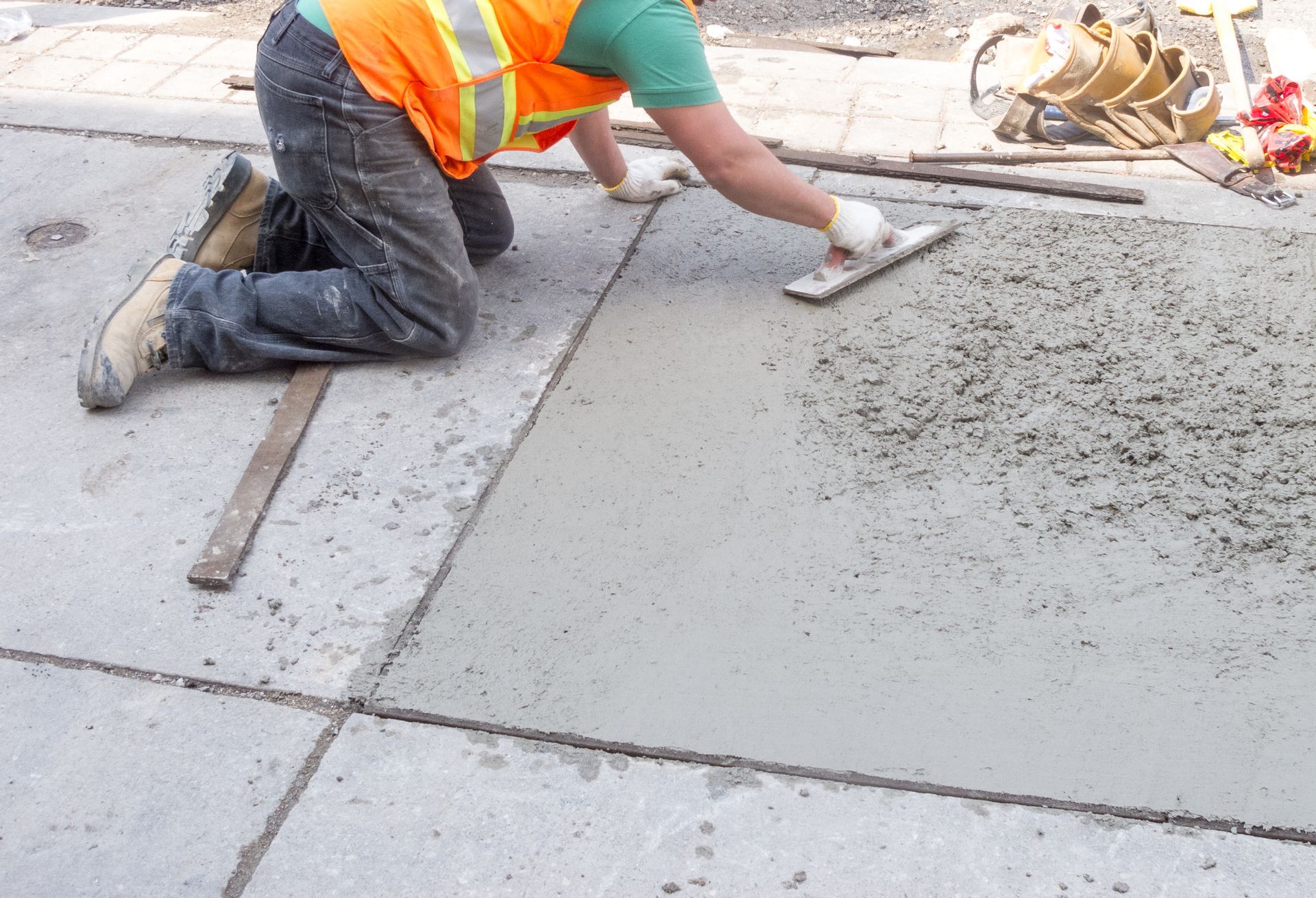 image of worker smoothing concrete