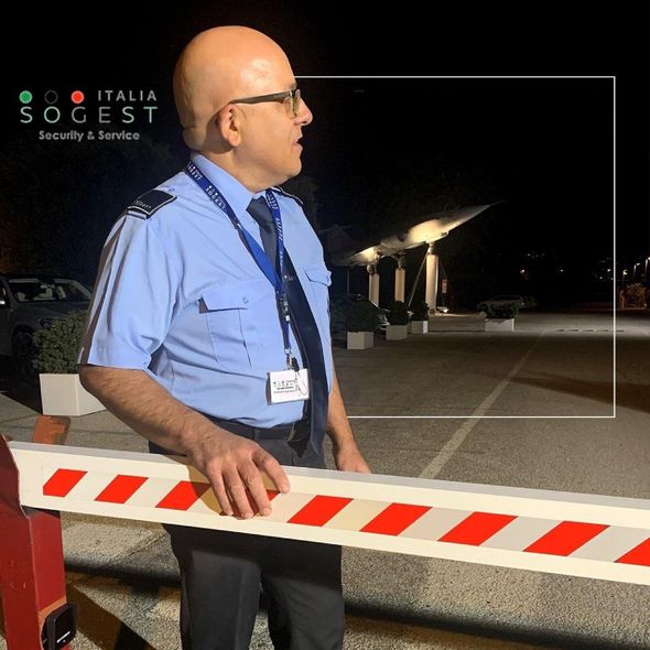 Security guard in front of barrier