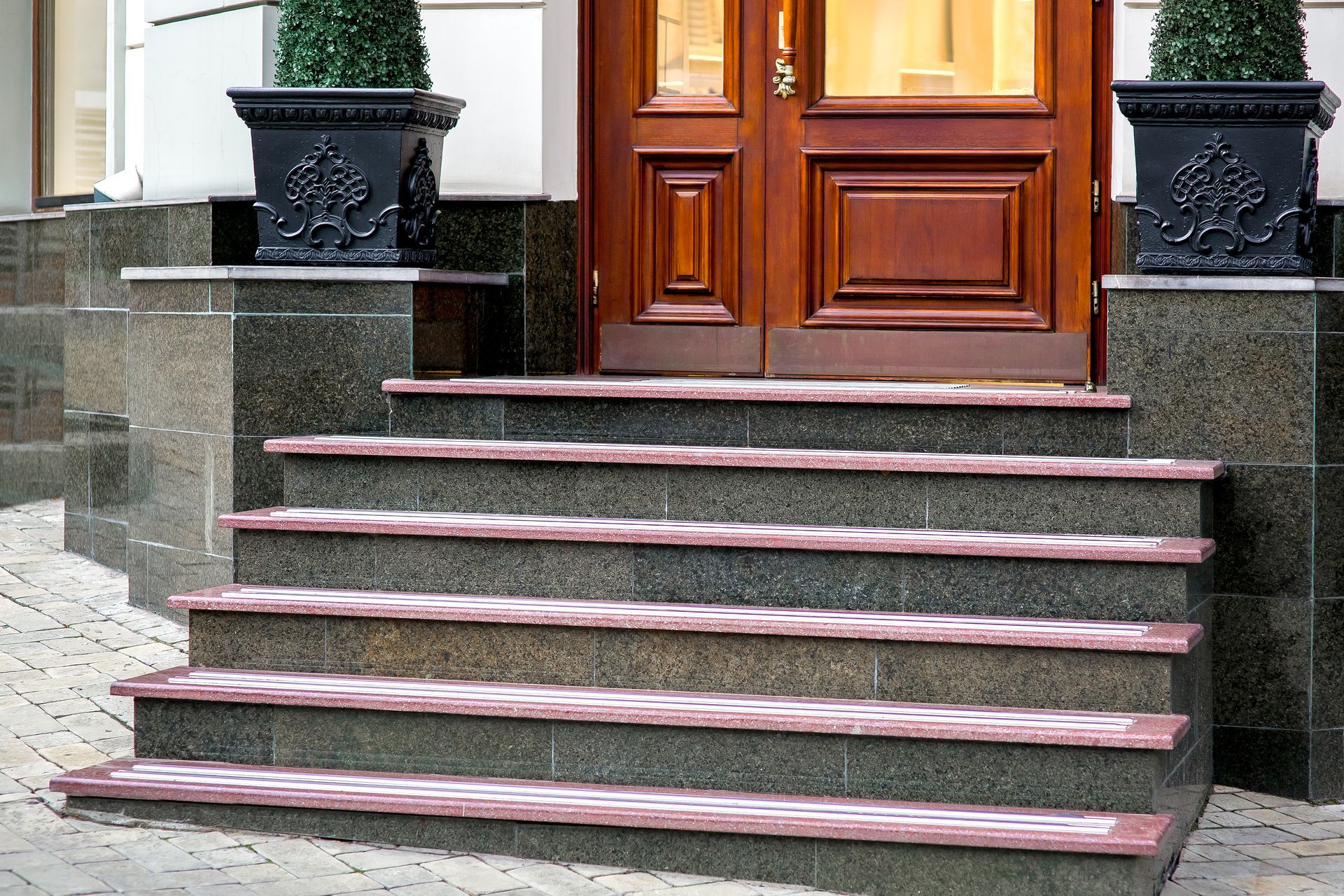 A set of stairs leading up to a wooden door.
