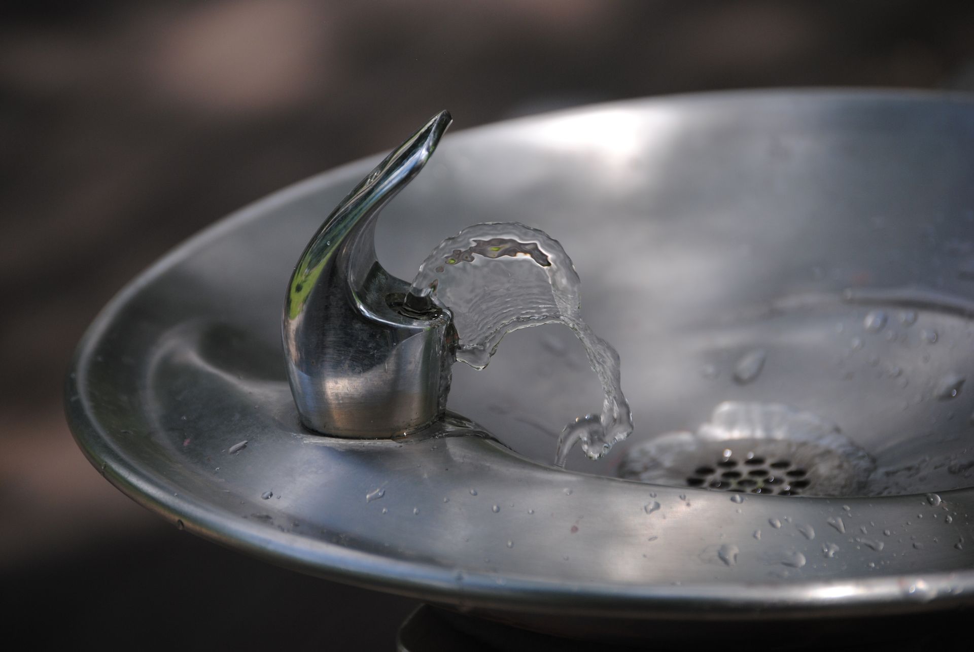 A close up of a water fountain with water coming out of it