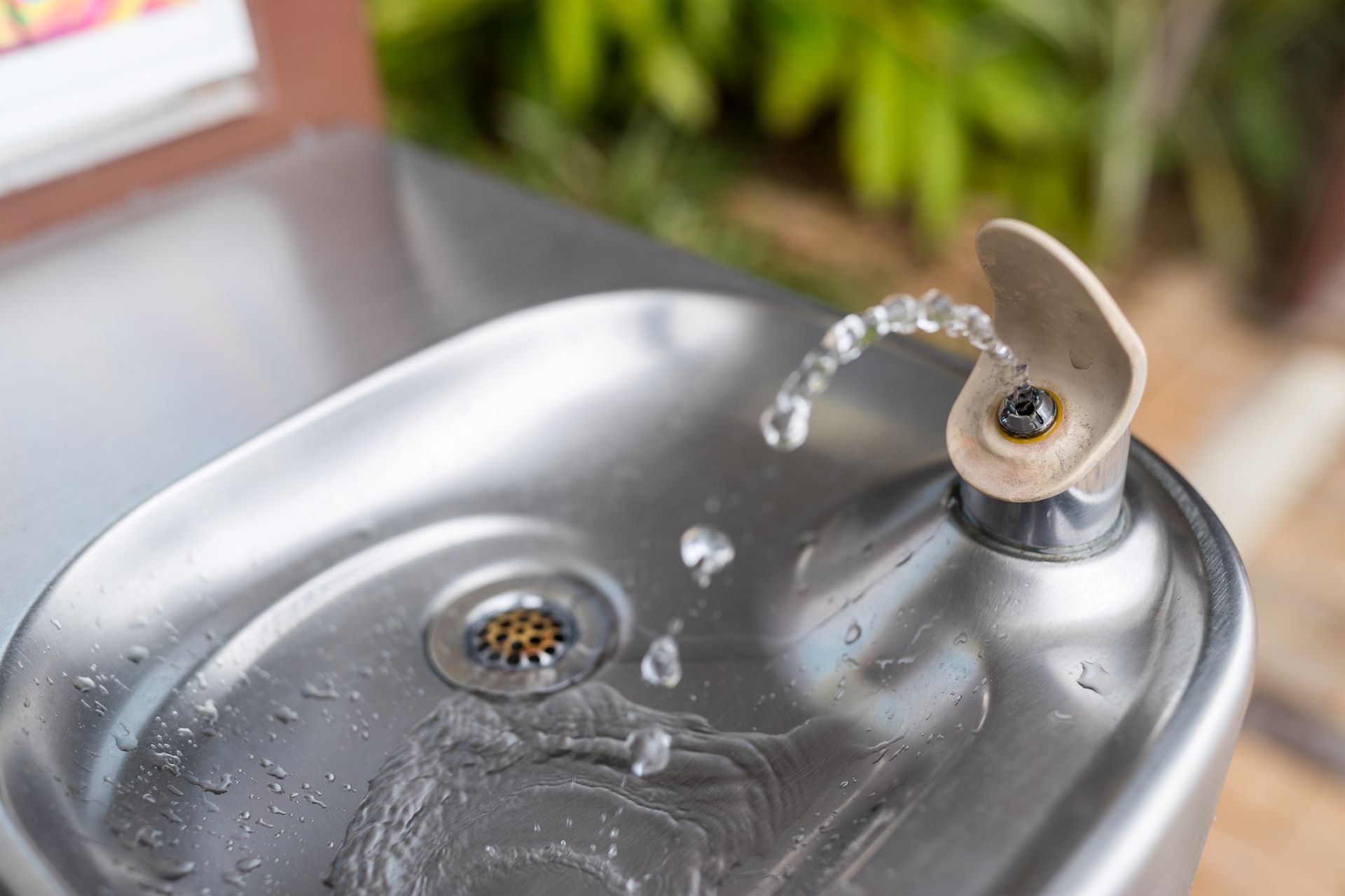 A close up of a water fountain with water coming out of it.
