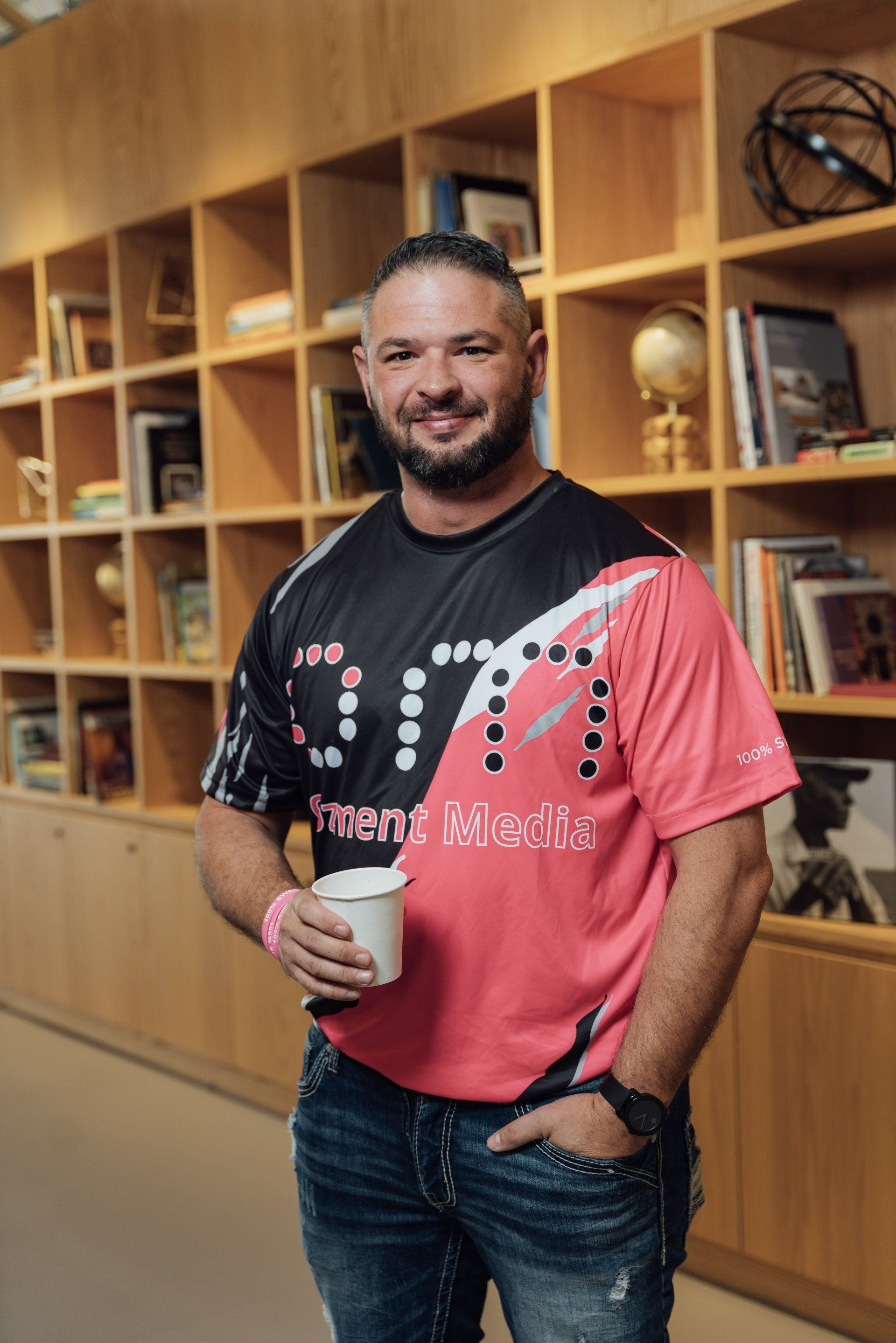 a man wearing a shirt that says ozment media