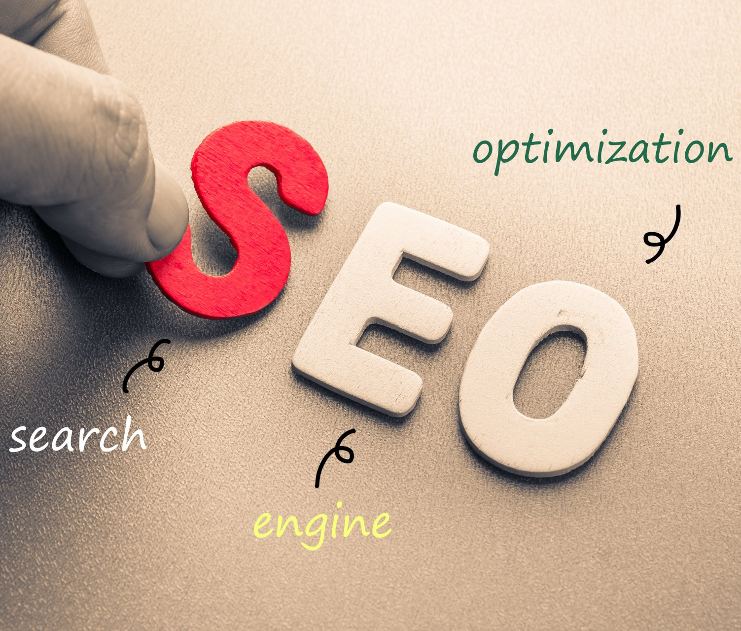 a hand is holding a red letter s above the word seo
