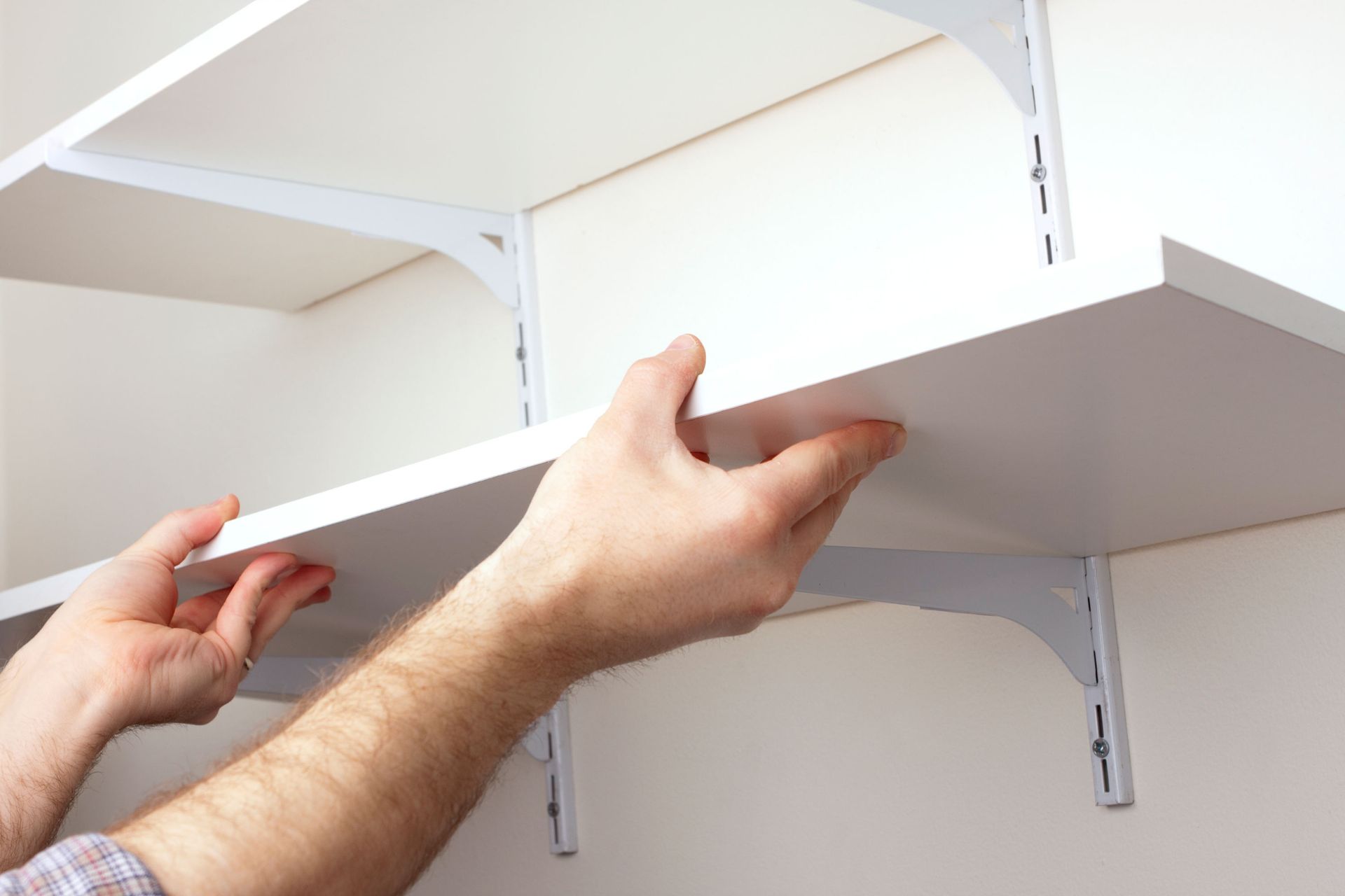 Installing hanging shelves | Adelaide, SA | Shopfitting Industries