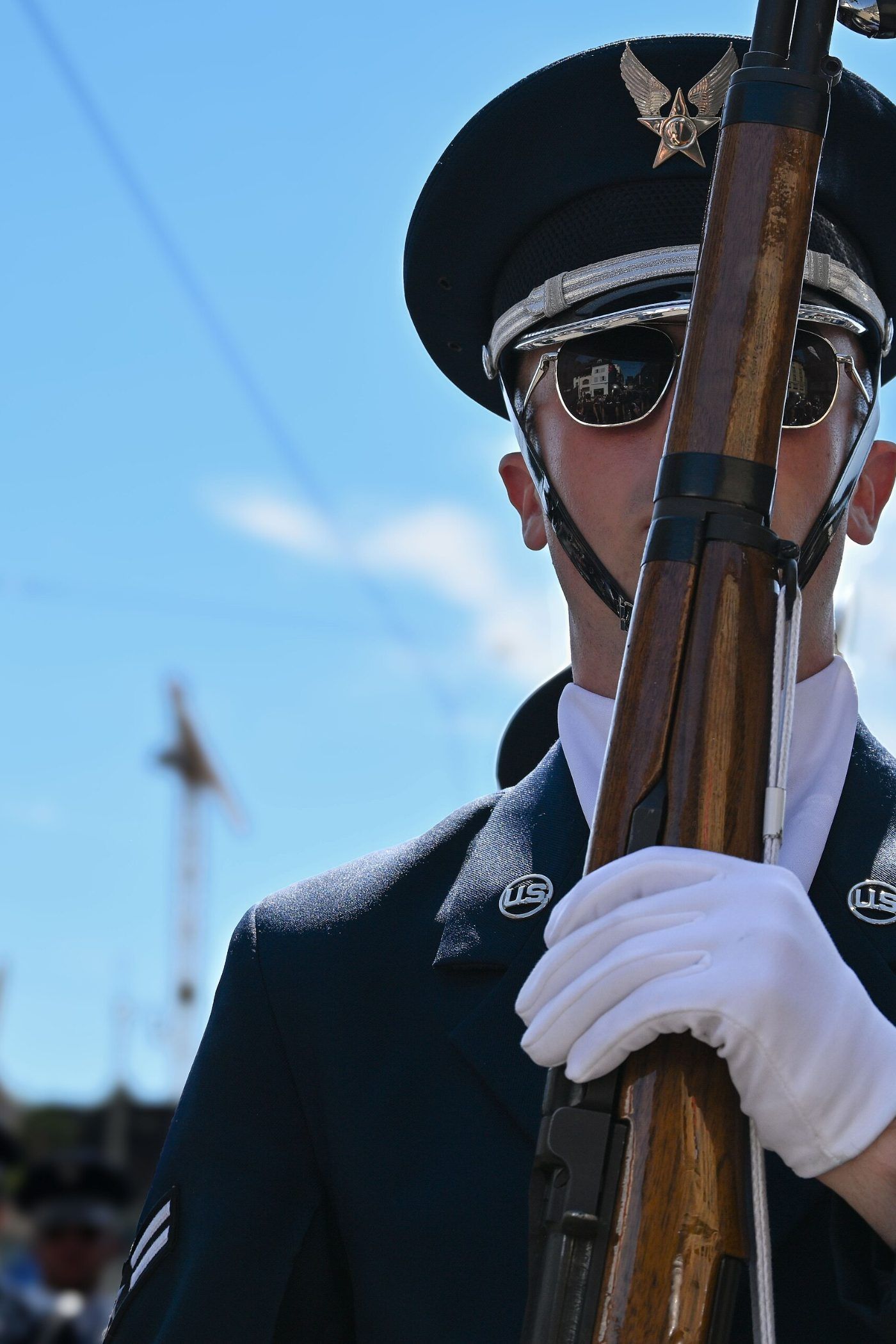 A United States service member in dress uniform on a color guard detail