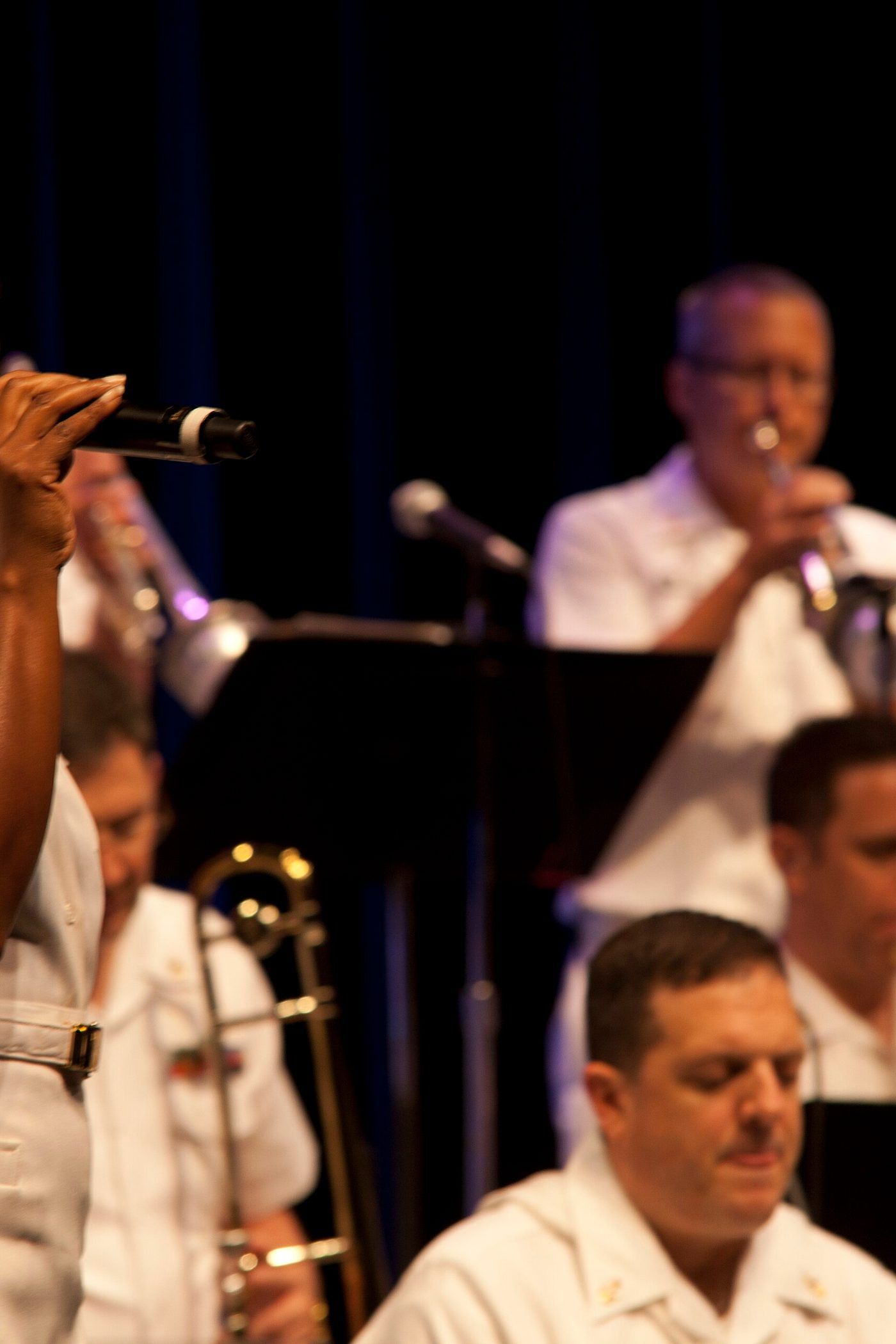A United States Air Force vocalist singing with a military band