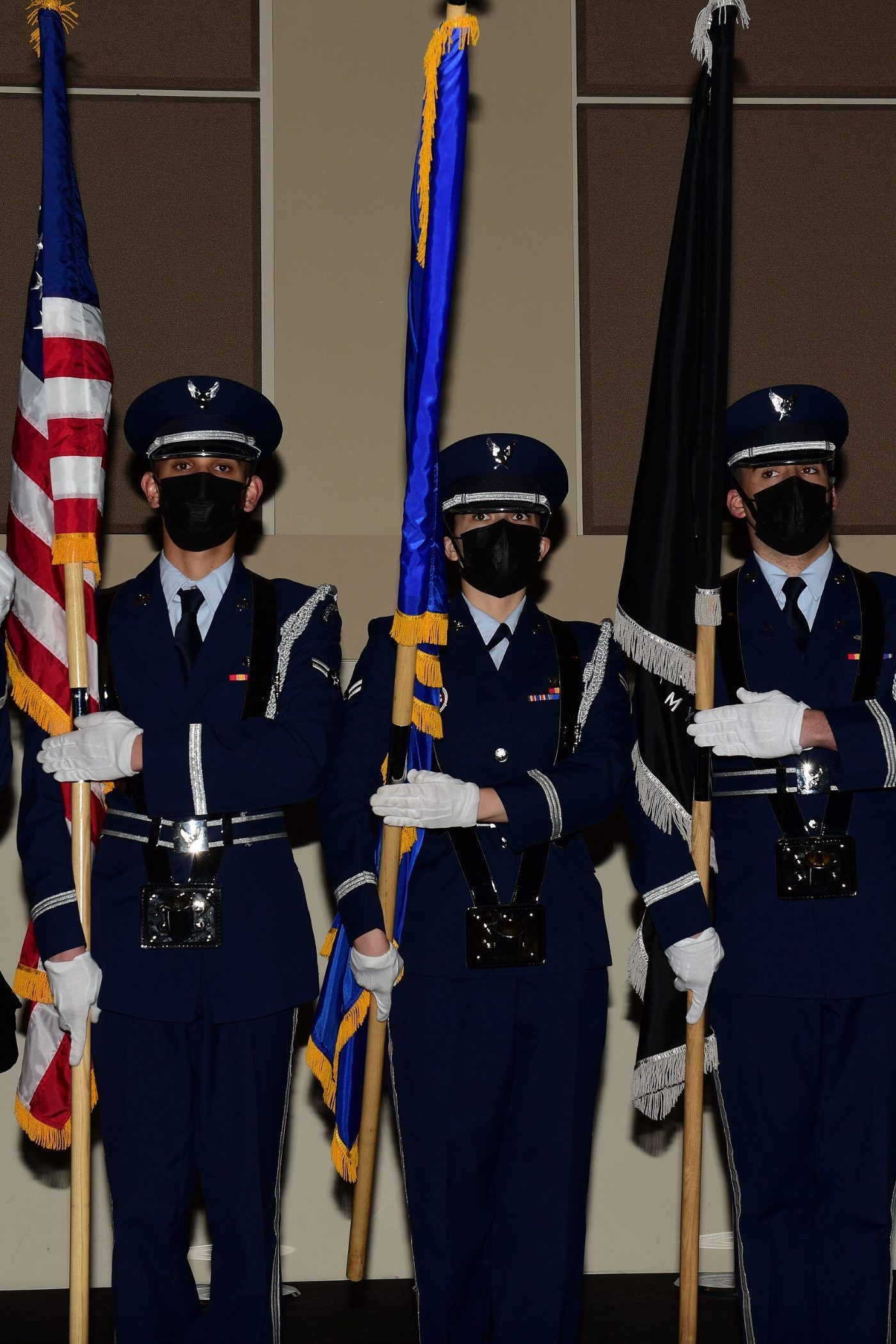 A United States Air Force honor guard standing with the national and service colors
