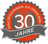 30 Jahre Qualitätshandwerk aus Vorarlberg badge in red, gray, and white