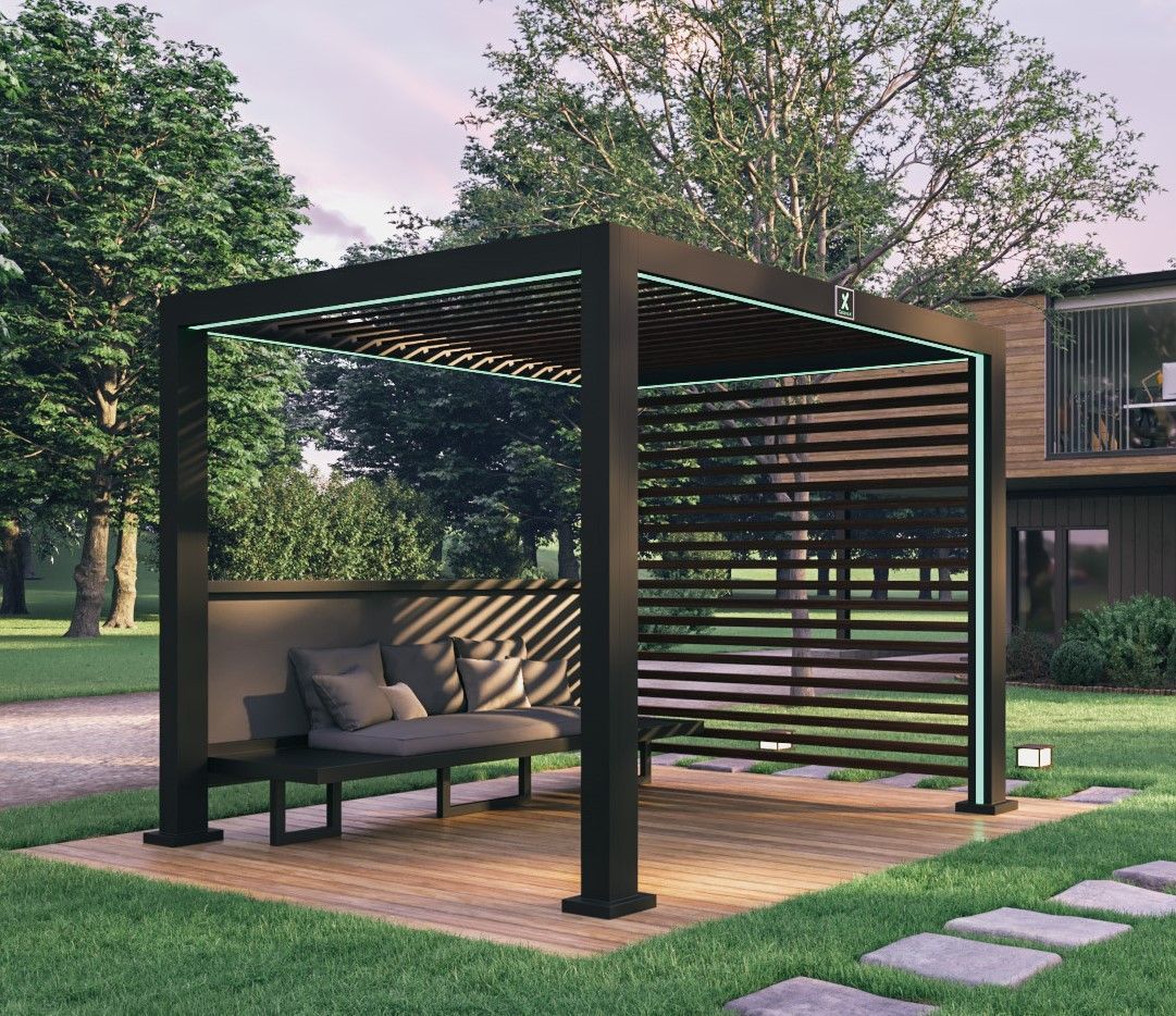 Modern outdoor pergola with built-in bench seating in a landscaped backyard, with trees and stepping stones.