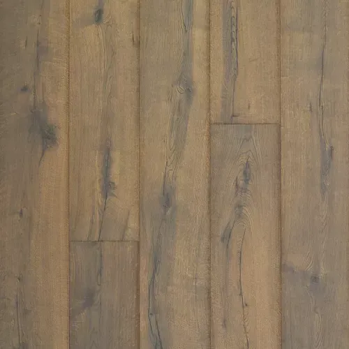 Wooden floor planks with a gray-brown weathered finish and visible grain patterns