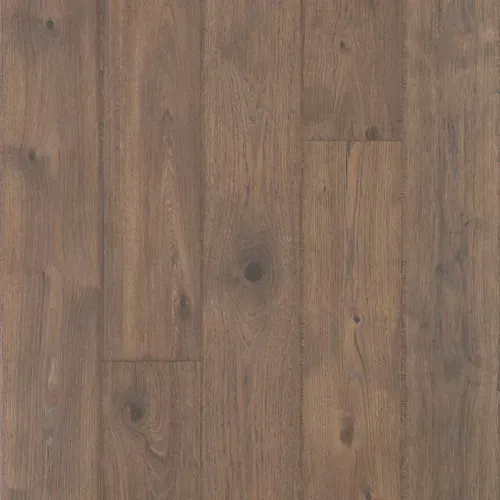 Close-up of brown wood plank flooring with visible grain and knots