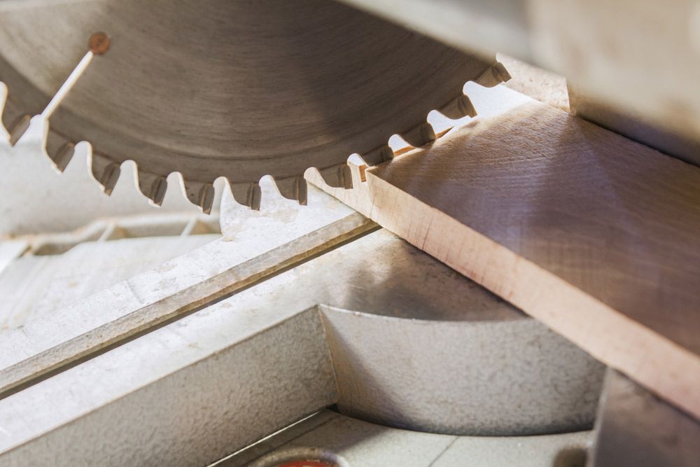 Compound Mitre Saw Cutting Planks — High-Quality Building Supplies in Tamworth, NSW