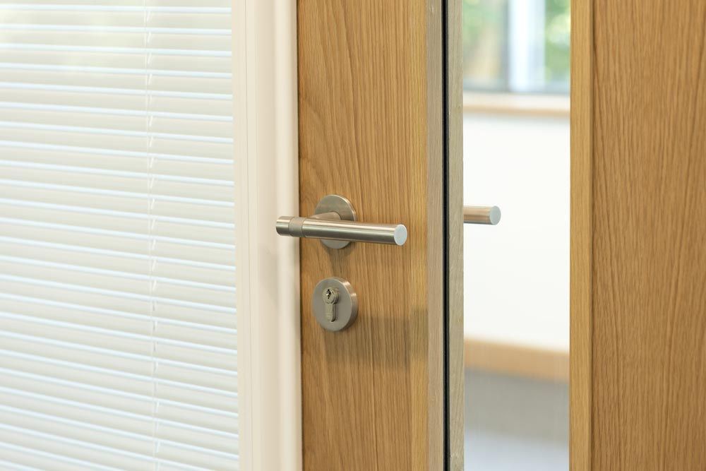 Door Focused On Handled To A Modern Office — High-Quality Building Supplies in Tamworth, NSW