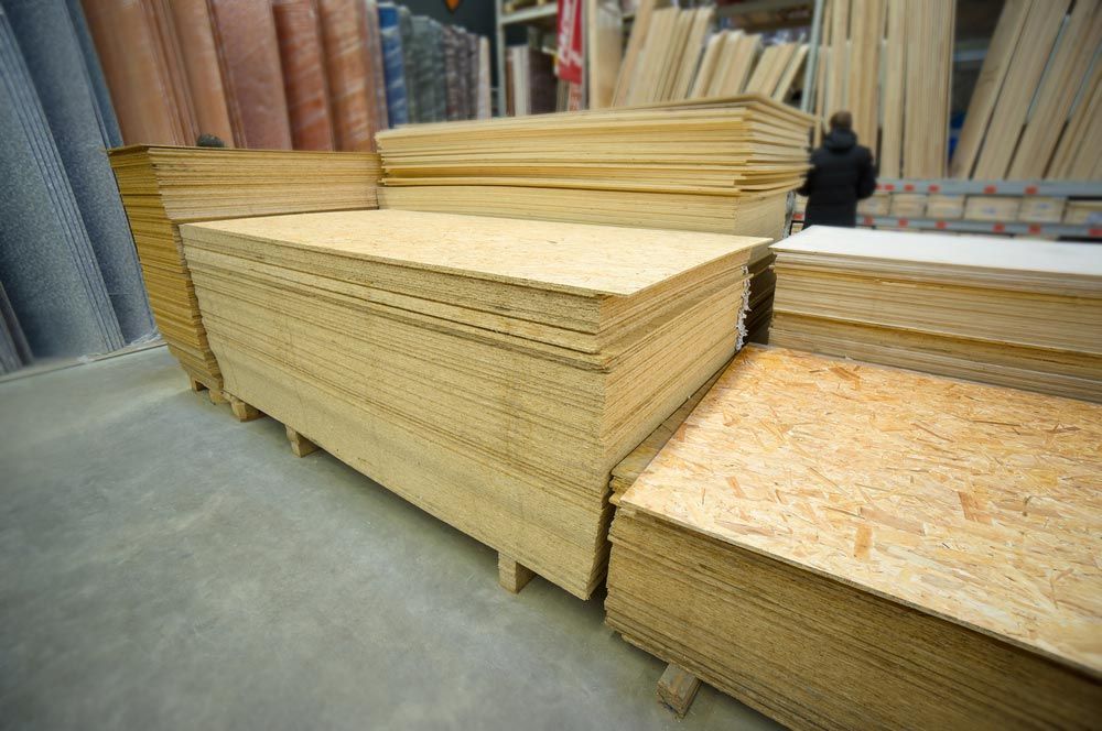 Plywood Of Different Dizes Lie On Racks And Pallets In Build — Building Supplies in Narrabri, NSW