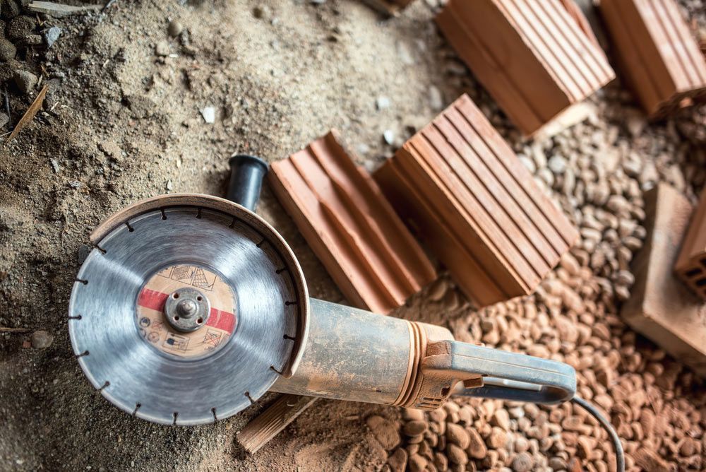 Angle Grinder Used On Construction Site — Quality Hardware & Tools in Tamworth, NSW