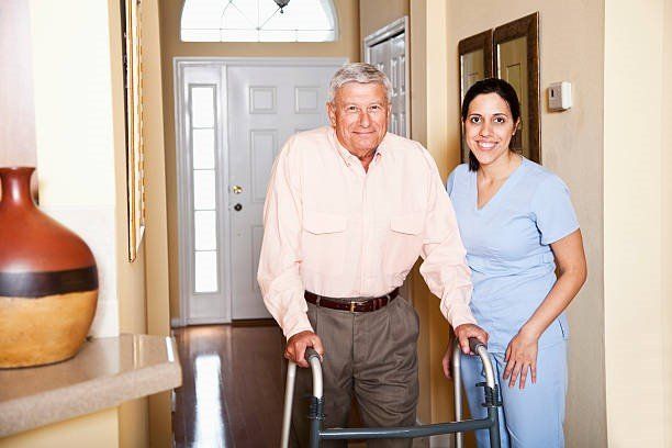 image-1314889-Home-Health-Aide-walking-senior.w640.jpg