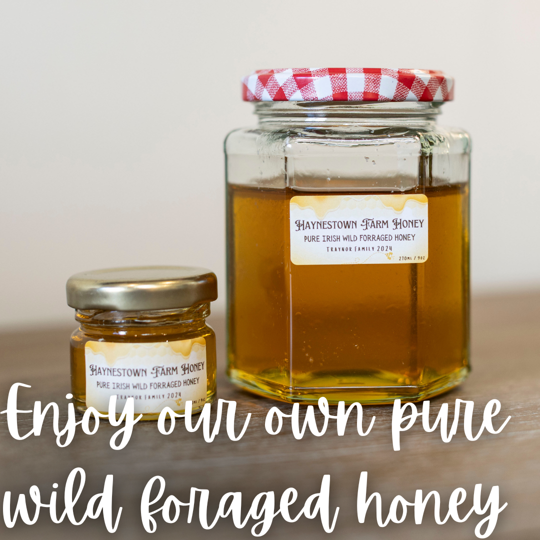 Two jars of honey on a table with the words enjoy your own pure wild foraged honey