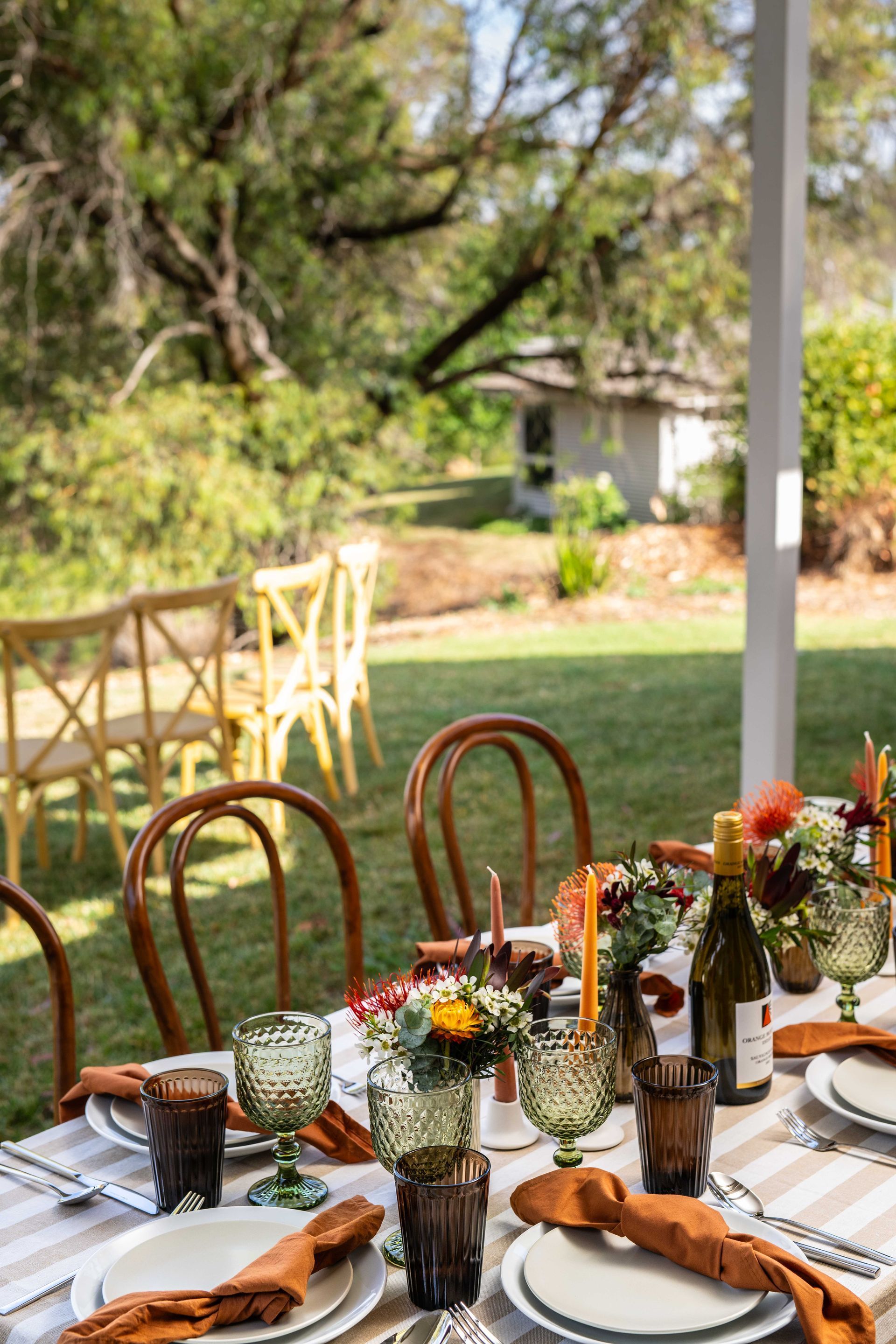Woman in White Dress Holding a Bouquet of Peach and White Flowers in A Field — Lakeview Luxury Retreat in Canobolas, NSW
