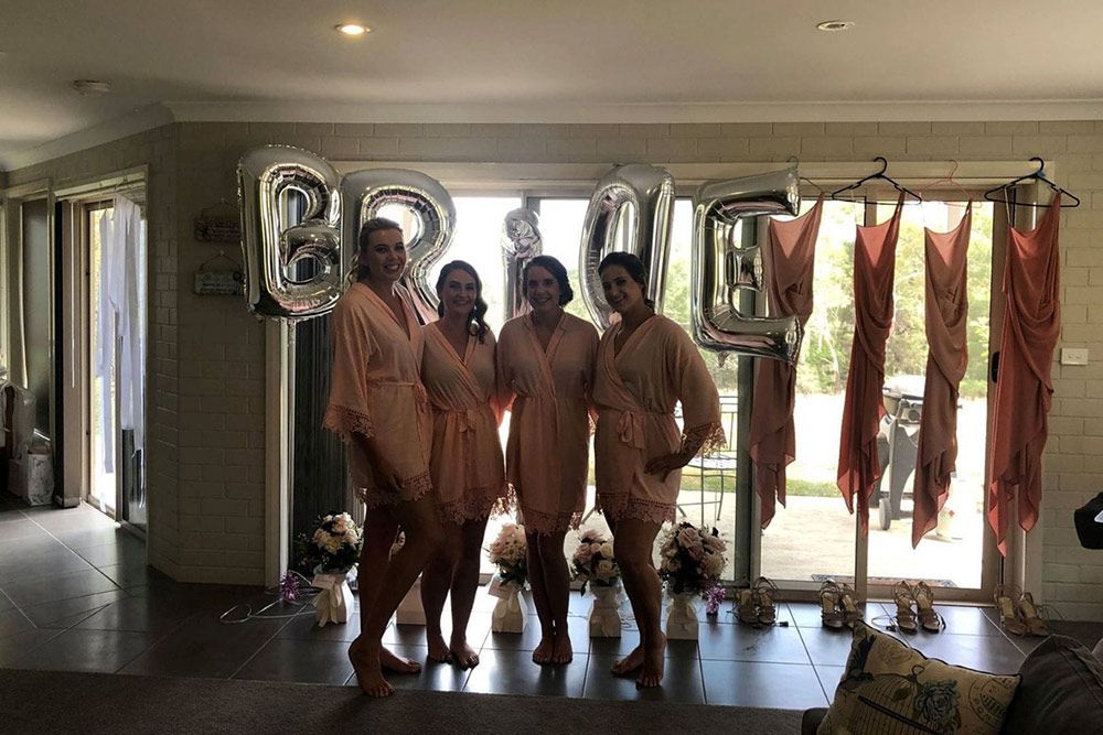 A Group of Women Standing Next to Each Other in a Living Room — Lakeview Luxury Retreat in Canobolas, NSW