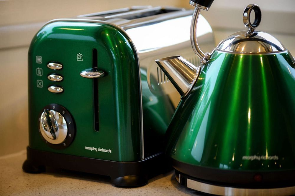 A Green Toaster and a Green Kettle Are on a Counter — Lakeview Luxury Retreat in Canobolas, NSW