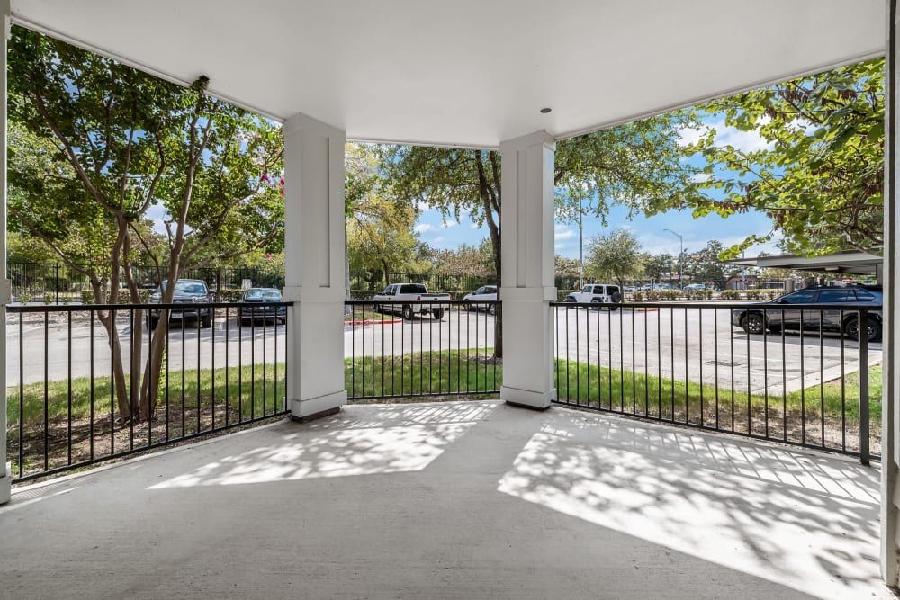 a balcony with a railing and a view of a parking lot at Marquis on Lakeline in Cedar Park, TX.