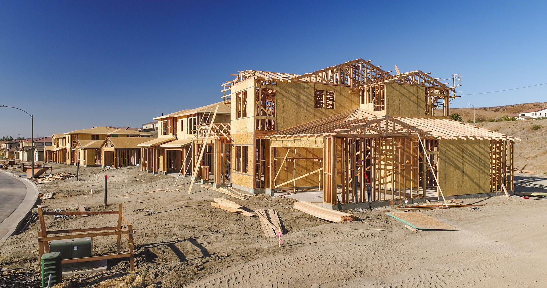 New homes are being built at a construction site after careful subdivision development.