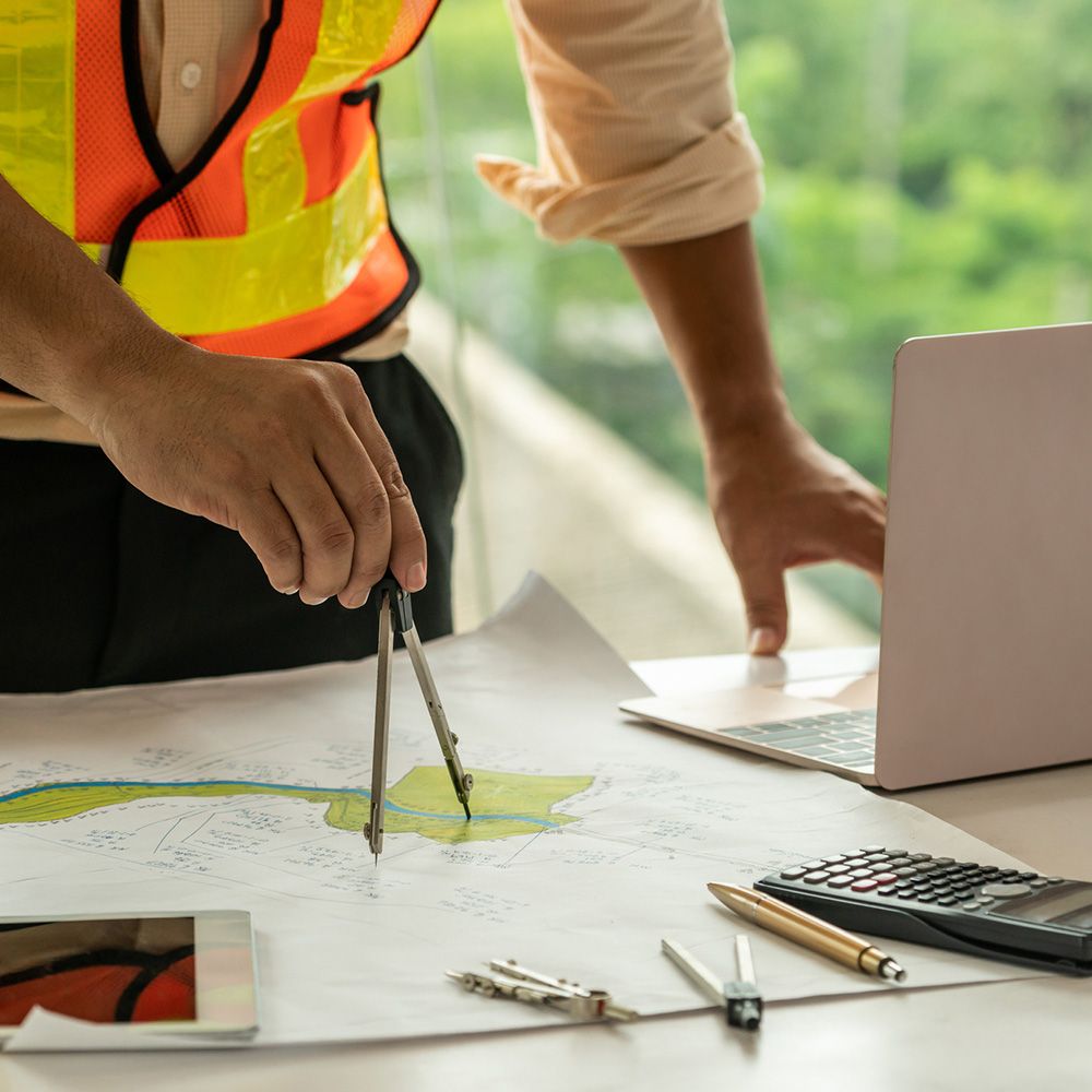 Engineer Working on His Table — Mornington Peninsula, VIC — Carson Development Consultants Pty Ltd Engineer Working on His Table — Mornington Peninsula, VIC — Carson Development Consultants Pty Ltd