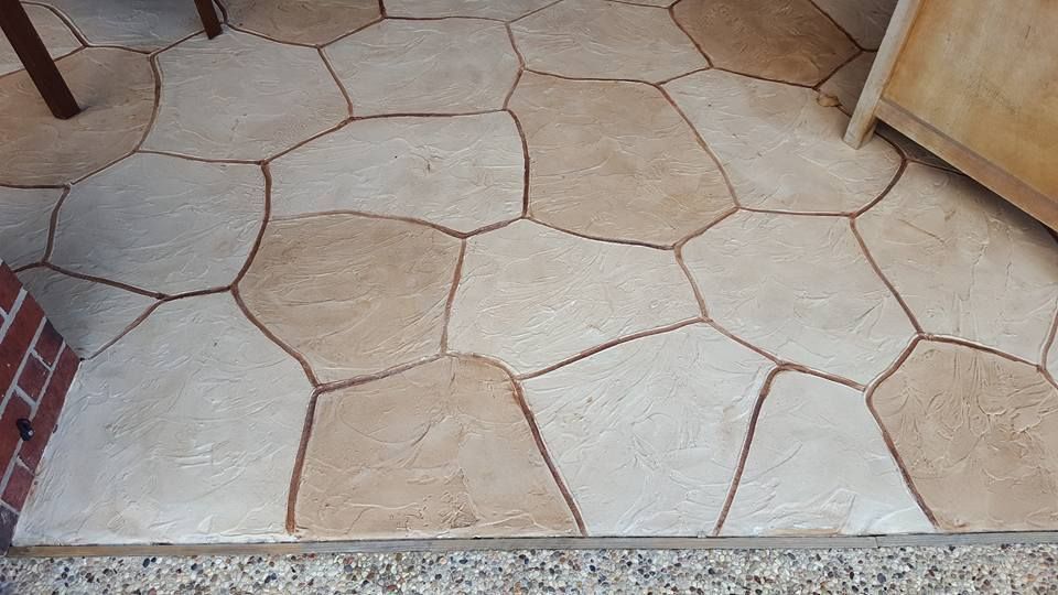 Beige stone-tile floor with irregular flagstone pattern and light grout lines