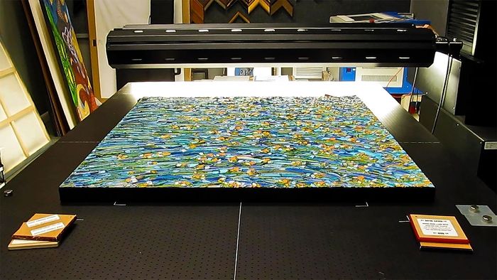 A large painting is being printed on a large printer