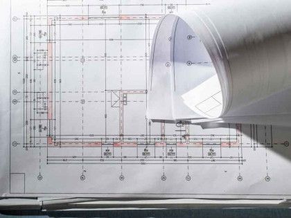 A close up of a drawing of a house on a table.