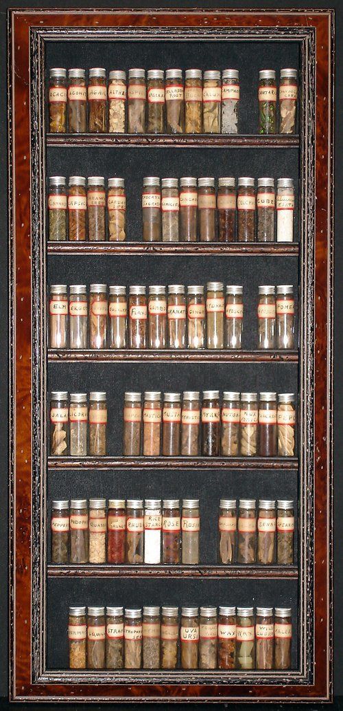A shelf filled with lots of small bottles