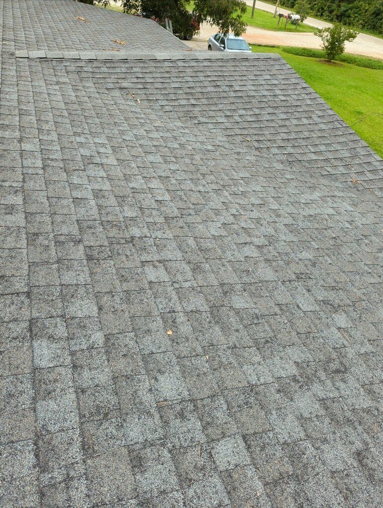 A close up of a roof with a lot of shingles on it.