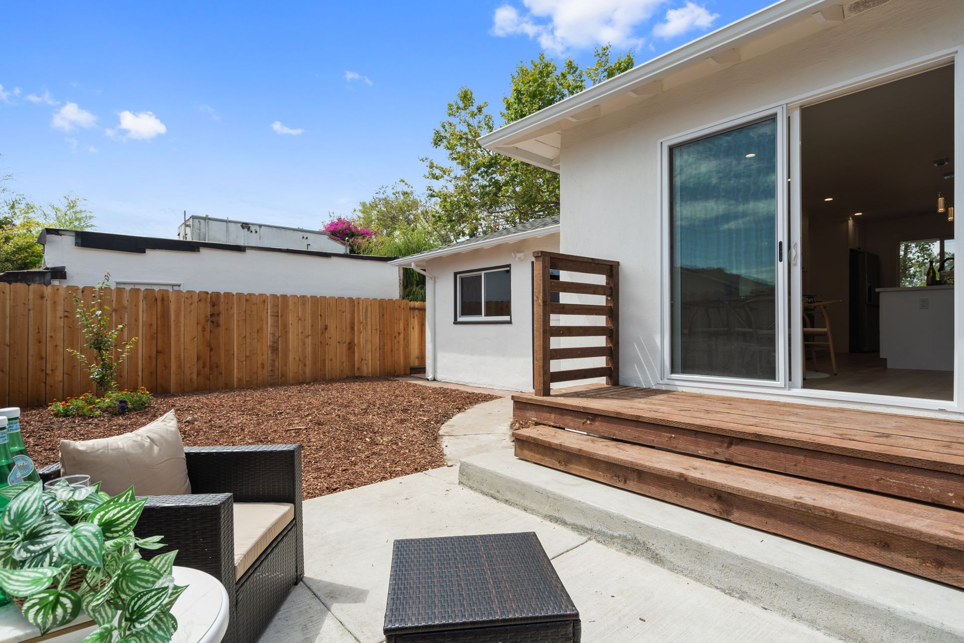 A house with a patio and sliding glass doors