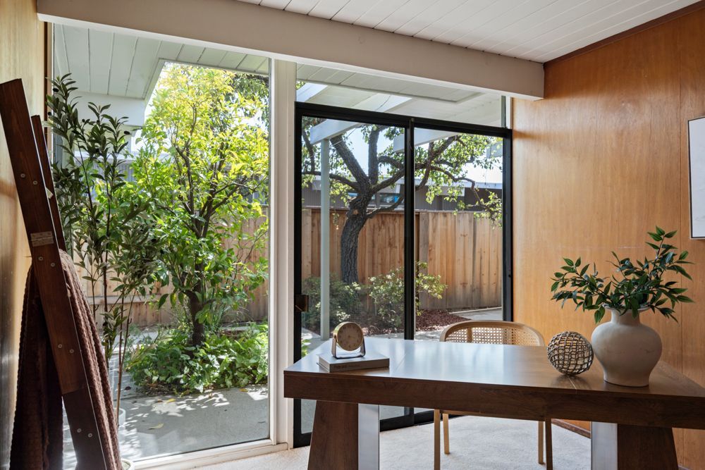 Versatile bedroom with patio access and outdoor connection, shown by Rumana Jabeen & Associates to appeal to buyers who value lifestyle and reassure sellers of market appeal.