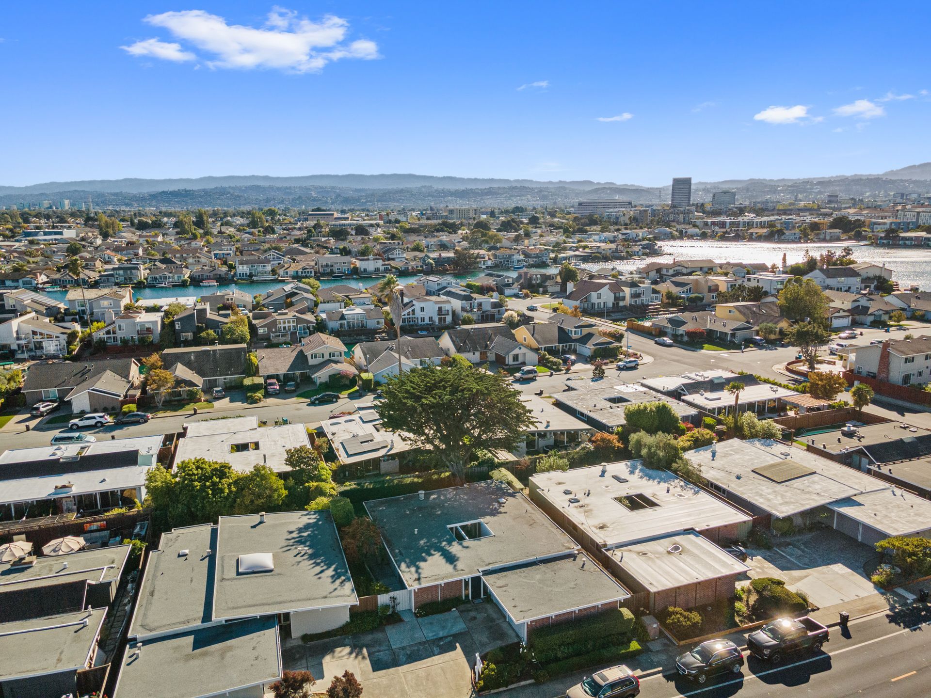 An aerial view of a residential area with lots of houses and trees.