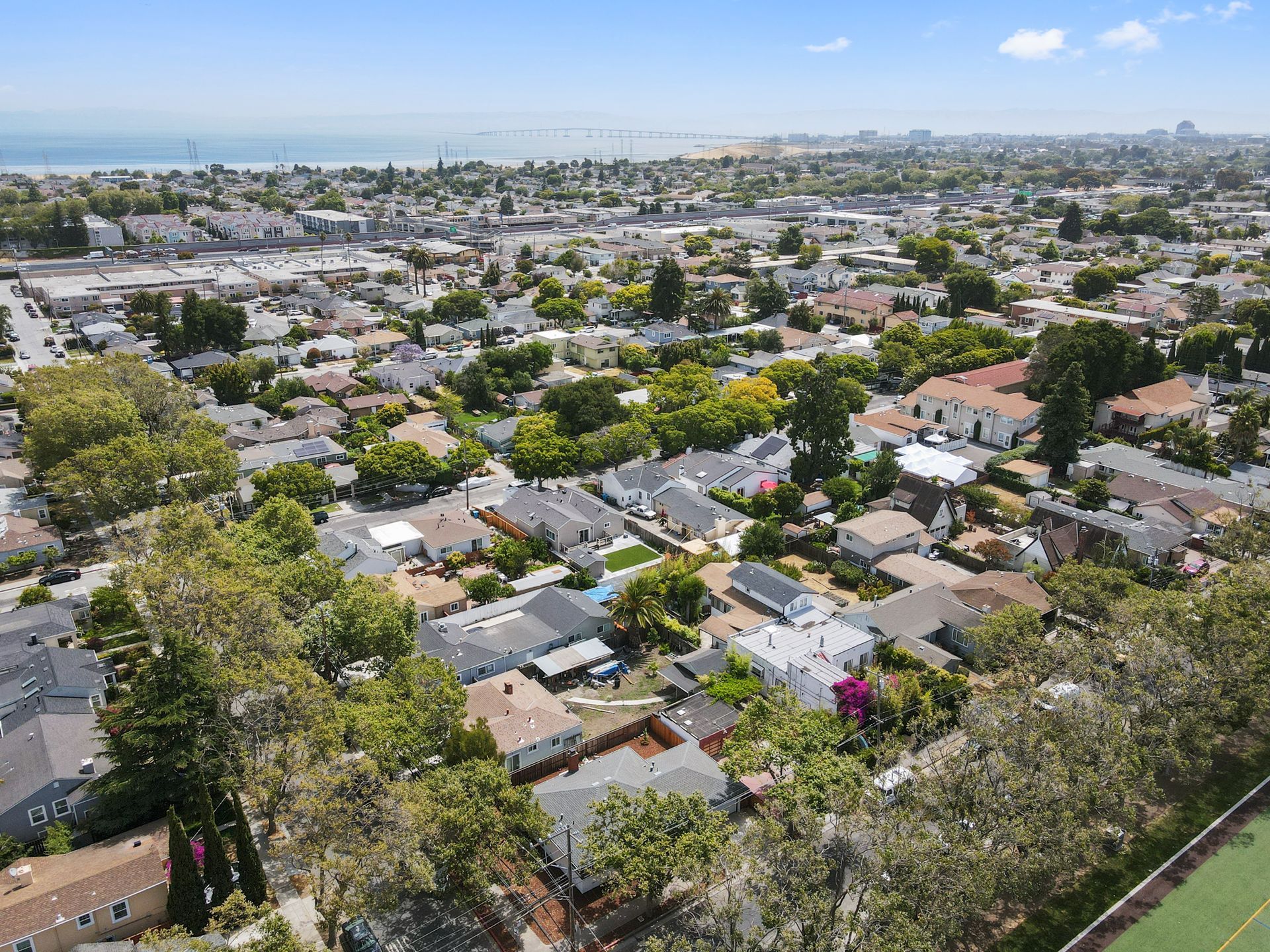 An aerial view of a residential area with lots of houses and trees.